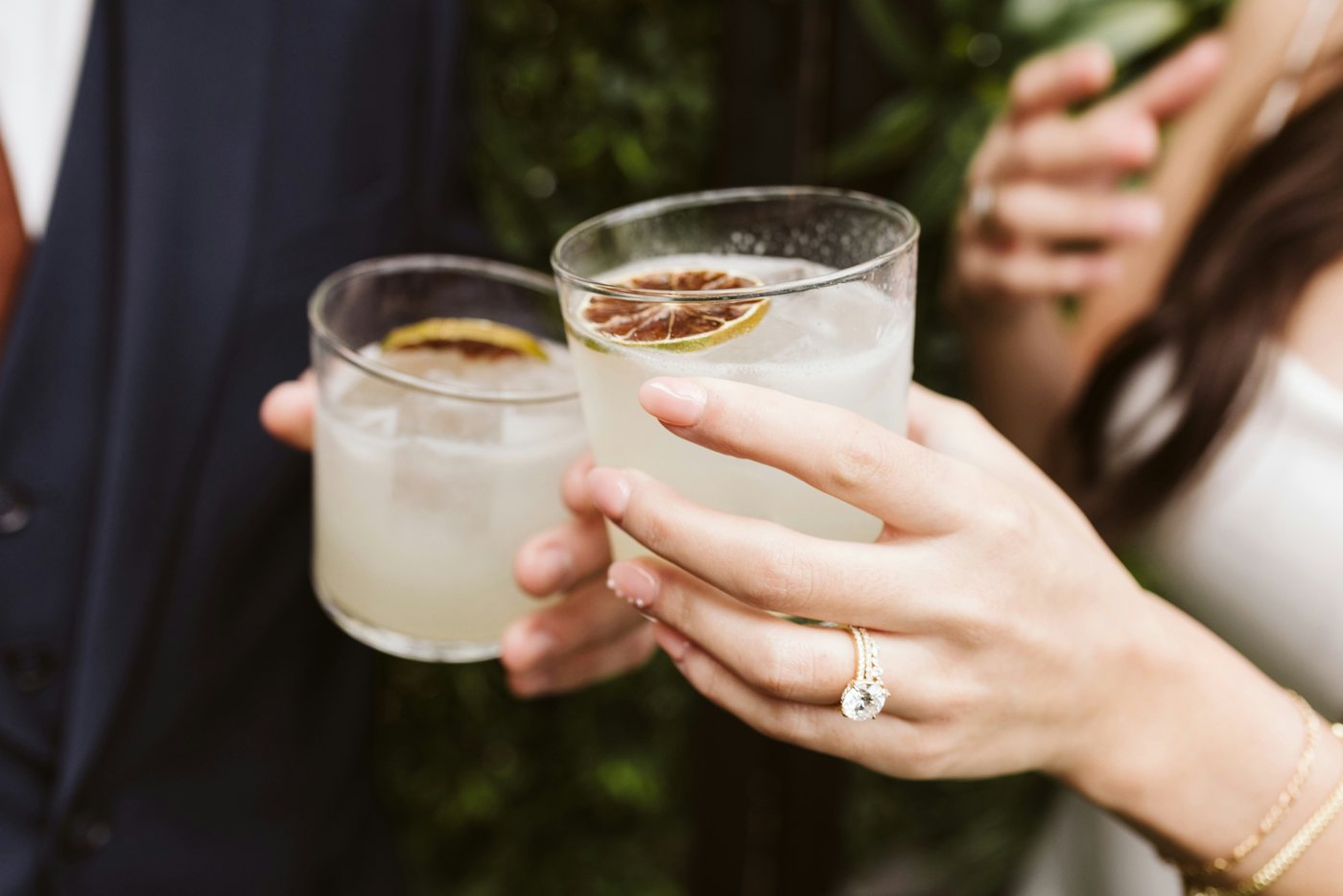 Newlyweds toasting with cocktails
